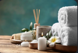 Spa towels, candles, and flowers